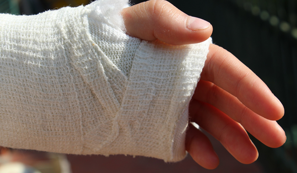 a close up of a bandaged hand